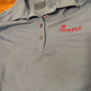 Small blue chick fil a shirt.